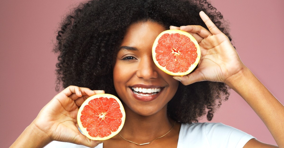 Woman with grapefruit